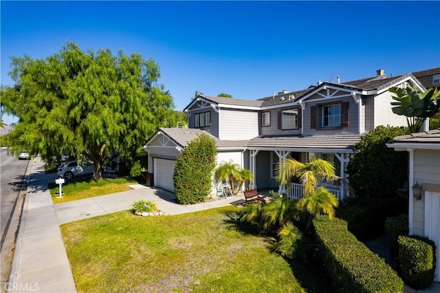 view of front of property with a garage and a front yard