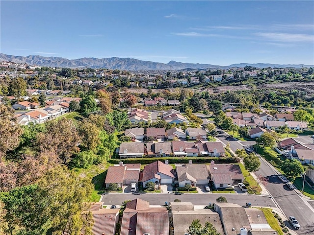 drone / aerial view featuring a residential view and a mountain view