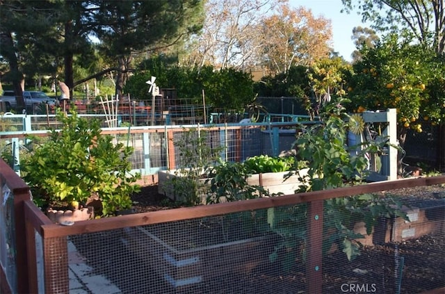 exterior space with a garden and fence