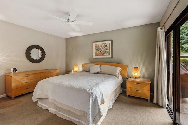 bedroom featuring ceiling fan and carpet