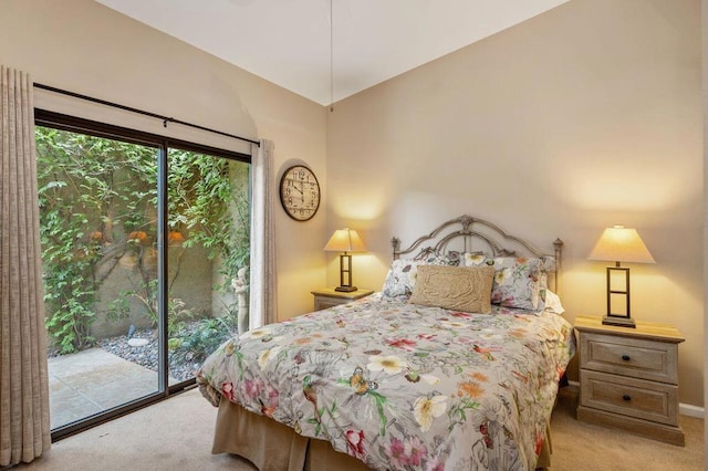 bedroom featuring light colored carpet and access to exterior