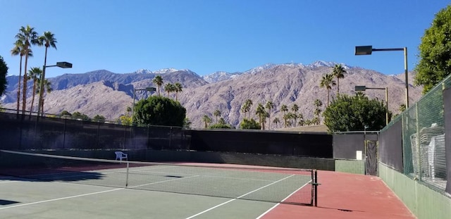 view of sport court with a mountain view