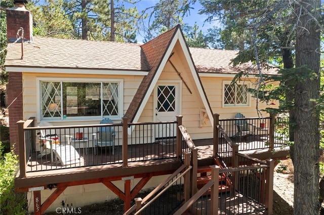 back of property featuring a deck