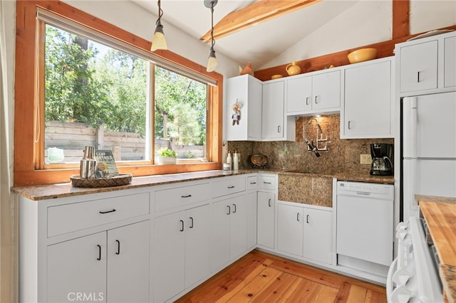 kitchen featuring pendant lighting, white appliances, white cabinets, and vaulted ceiling