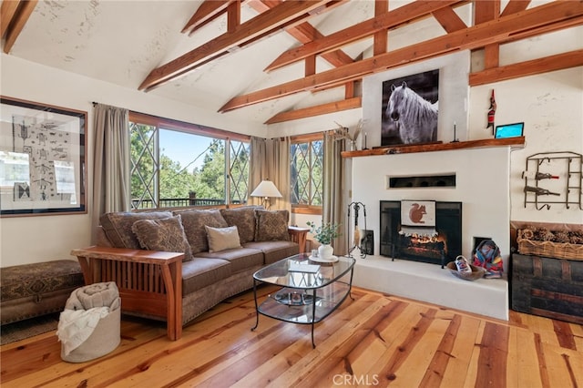 living room with hardwood / wood-style flooring and lofted ceiling with beams