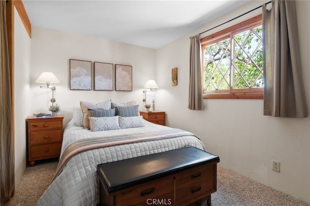 bedroom featuring light carpet