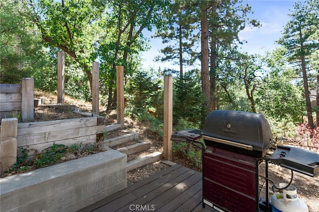 wooden terrace with area for grilling