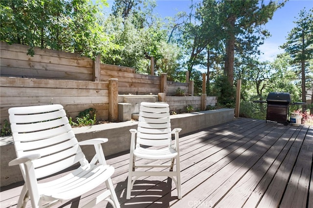 wooden deck with grilling area