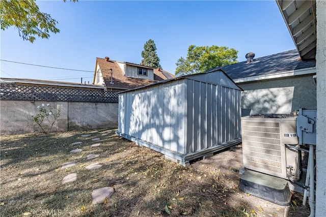 view of property exterior featuring cooling unit and a storage unit