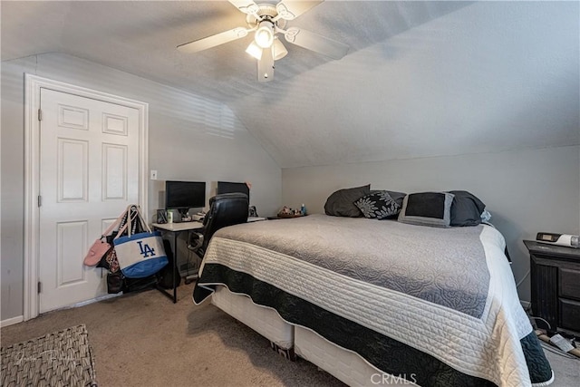 bedroom featuring ceiling fan, carpet floors, and lofted ceiling