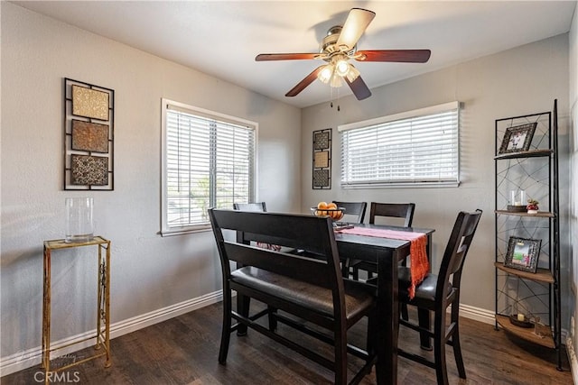 dining space featuring ceiling fan and dark hardwood / wood-style floors