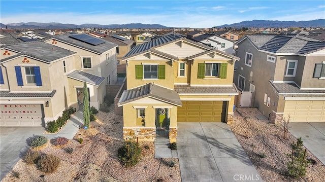 view of front of house featuring a mountain view and a garage