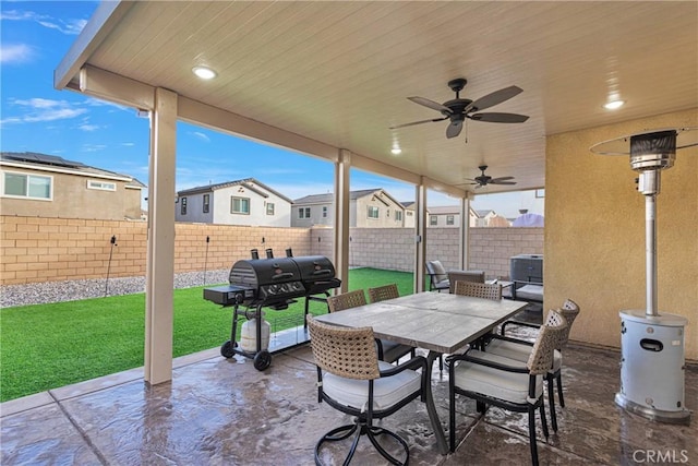 view of patio with grilling area and ceiling fan