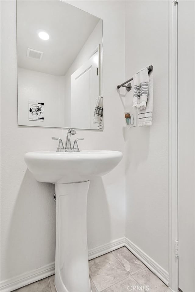 bathroom featuring sink and tile patterned flooring