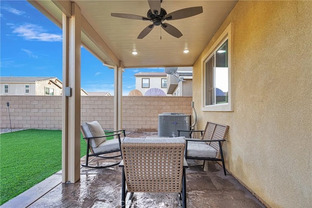 view of patio featuring ceiling fan and cooling unit