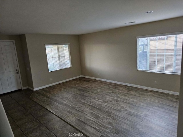 unfurnished room featuring dark hardwood / wood-style floors