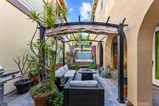 view of patio with a hot tub and a pergola