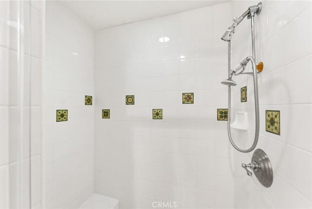 full bath featuring tiled shower