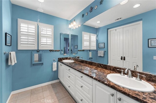 bathroom with vanity and tile patterned floors