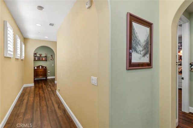 hallway with dark wood-type flooring