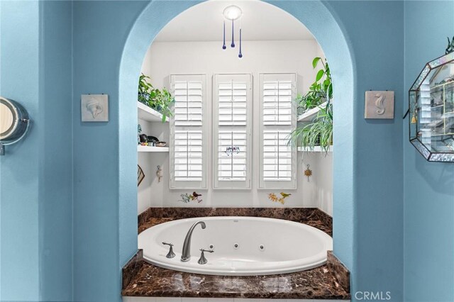 bathroom featuring a tub to relax in