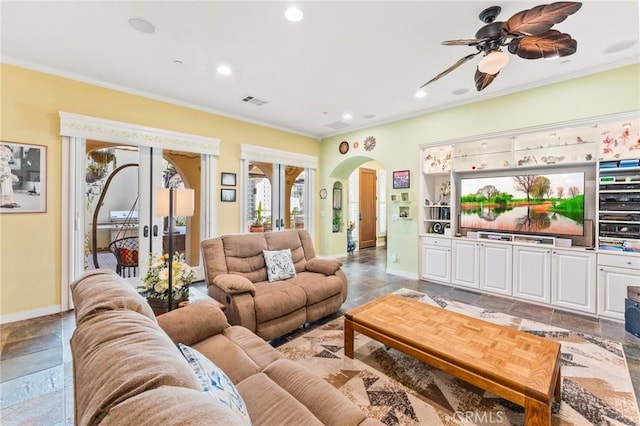 living room featuring arched walkways, recessed lighting, visible vents, ornamental molding, and baseboards