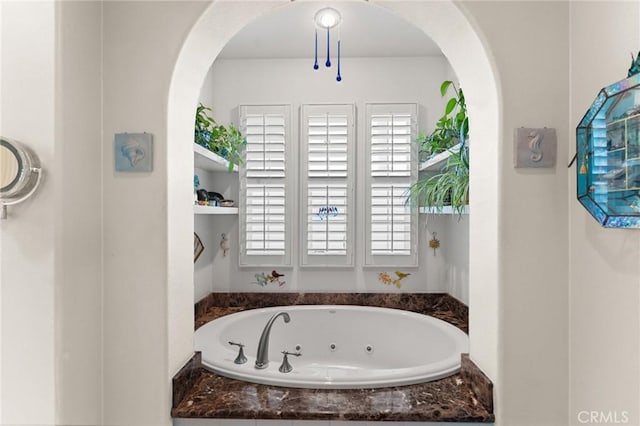 bathroom featuring a whirlpool tub