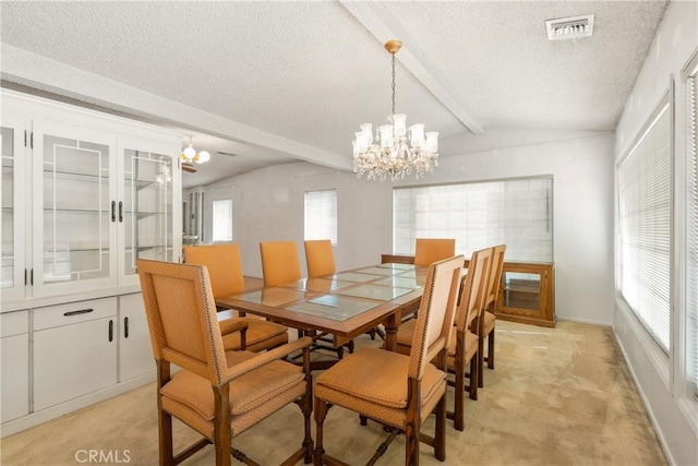 dining space featuring light colored carpet, lofted ceiling with beams, an inviting chandelier, and a textured ceiling