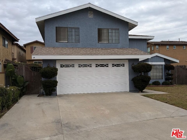 view of front of property with a garage