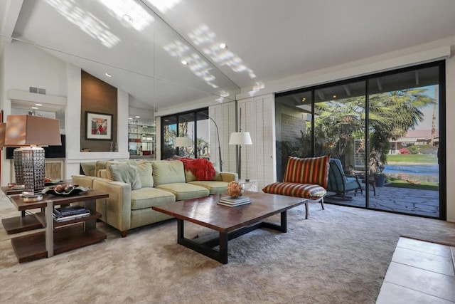 living room with high vaulted ceiling