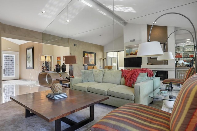 living room with high vaulted ceiling