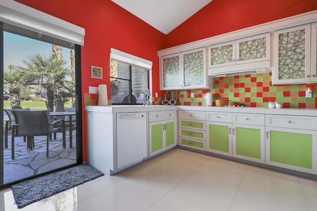 kitchen with vaulted ceiling, white cabinetry, white dishwasher, and plenty of natural light