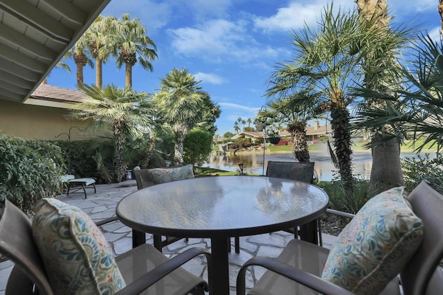 view of patio with a water view