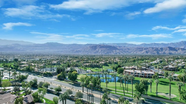 birds eye view of property with a water and mountain view