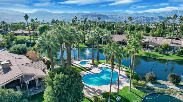 bird's eye view featuring a water and mountain view