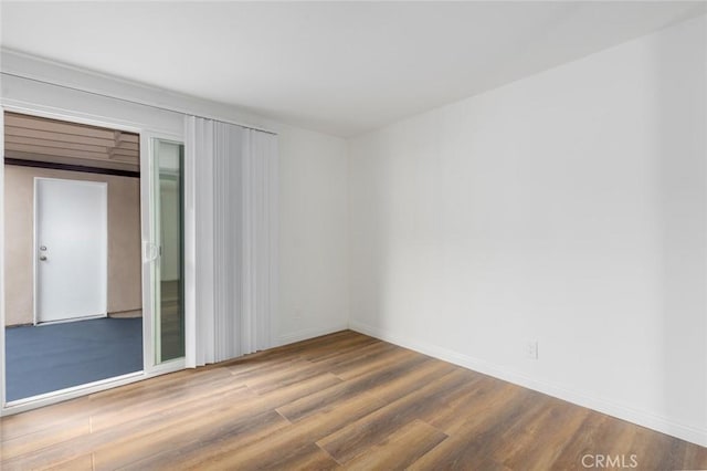 spare room featuring hardwood / wood-style flooring