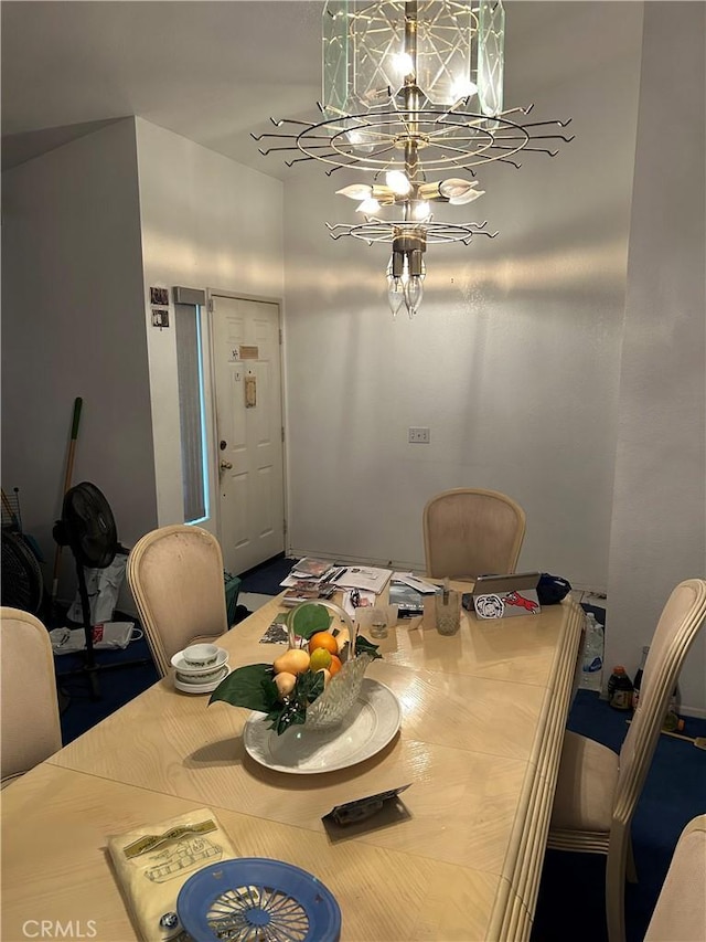 dining space with a notable chandelier