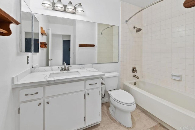 full bathroom featuring tile patterned floors, toilet, bathing tub / shower combination, and vanity