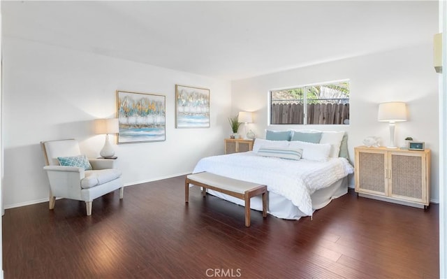 bedroom featuring dark hardwood / wood-style flooring