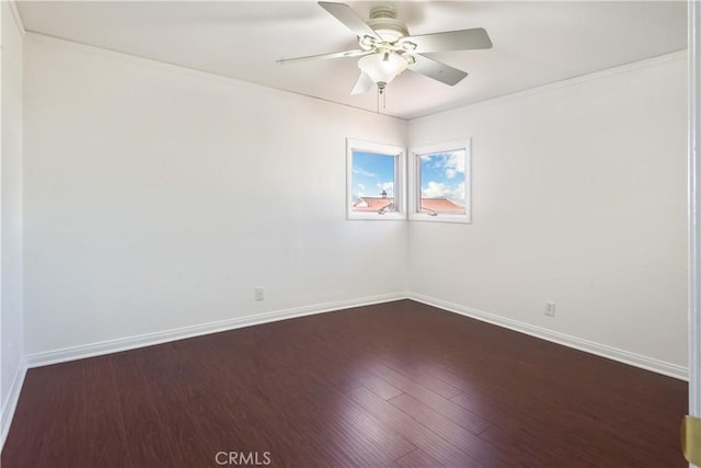 empty room featuring ceiling fan and dark hardwood / wood-style flooring