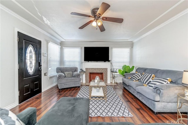 living room featuring ceiling fan, dark hardwood / wood-style floors, and ornamental molding