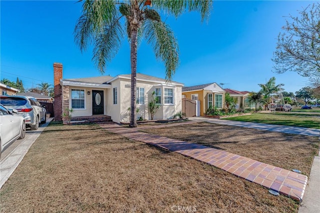 single story home with a front yard