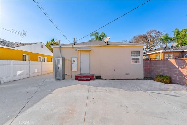 rear view of house with a patio