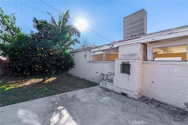 view of side of home featuring a patio