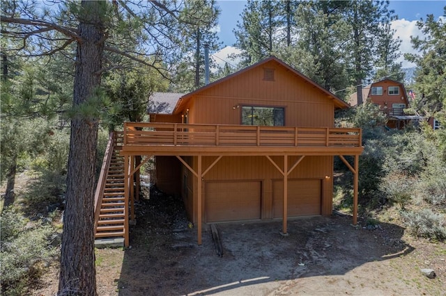 2206 Bernina Dr, Pine Mountain Club, CA 93222 - view of front facade featuring stairs, a wooden deck, and a detached garage