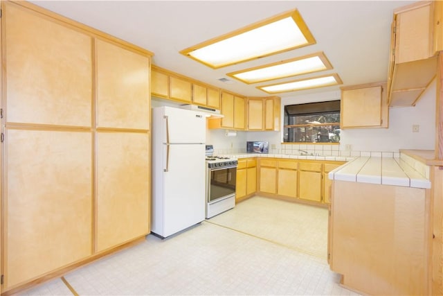 2206 Bernina Dr, Pine Mountain Club, CA 93222 - kitchen featuring white appliances, light brown cabinetry, extractor fan, a sink, and tile countertops