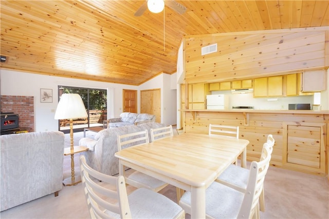 2206 Bernina Dr, Pine Mountain Club, CA 93222 - dining area featuring wood ceiling, light colored carpet, a wood stove, a ceiling fan, and high vaulted ceiling