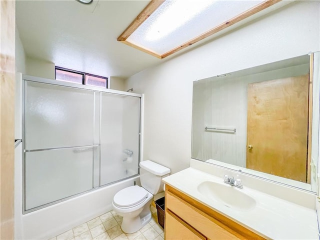 2206 Bernina Dr, Pine Mountain Club, CA 93222 - bathroom featuring vanity, toilet, combined bath / shower with glass door, and tile patterned flooring