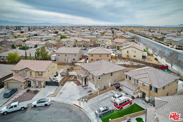 birds eye view of property with a mountain view