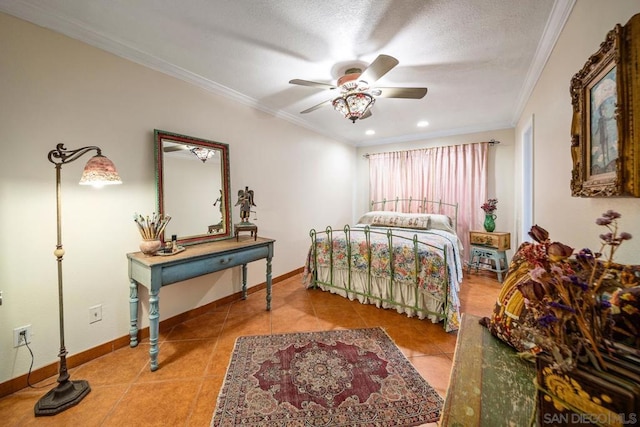 tiled bedroom featuring ceiling fan, a textured ceiling, and crown molding